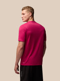 Back view of pink Adapt Training T-Shirt with AerTek branding at lower back
