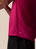 Close-up of pink Adapt Training T Shirt hem with AerTek branding.