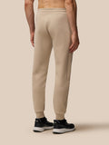Back view of beige mushroom Flex Lifestyle Joggers showing elasticated waistband and relaxed fit.