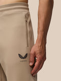 Close-up of beige Flex Lifestyle Joggers with a vertical hip zip pocket and Castore branding on the leg