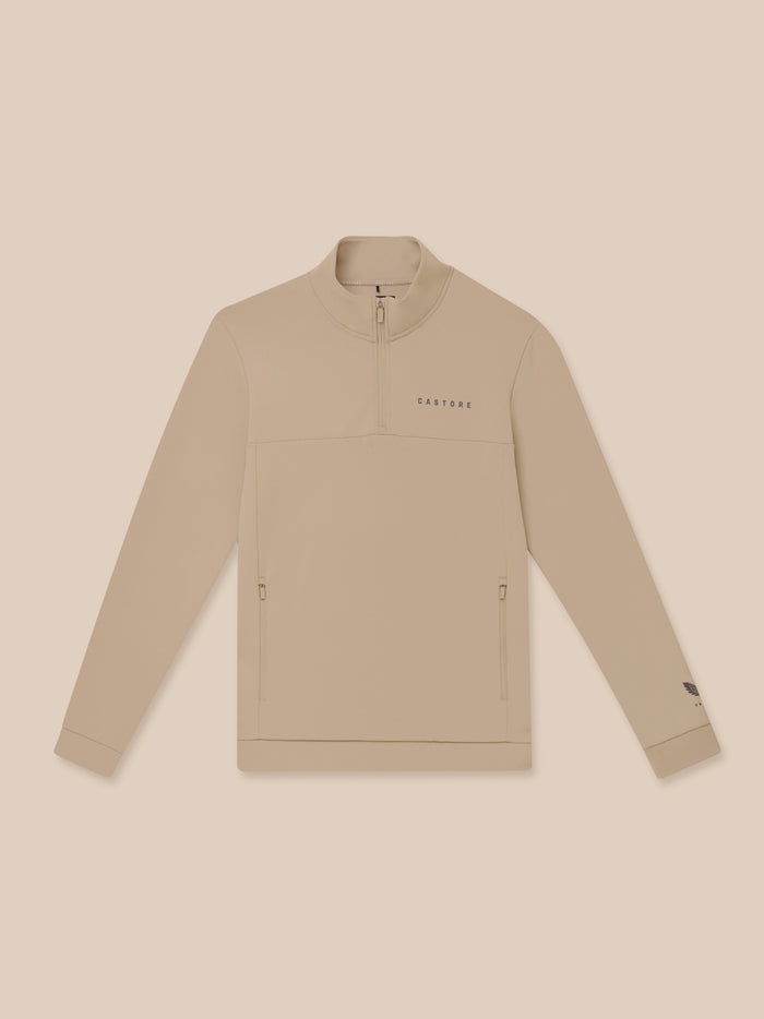 Beige Flex Lifestyle quarter zip fleece top with Castore branding on the chest and zip pockets