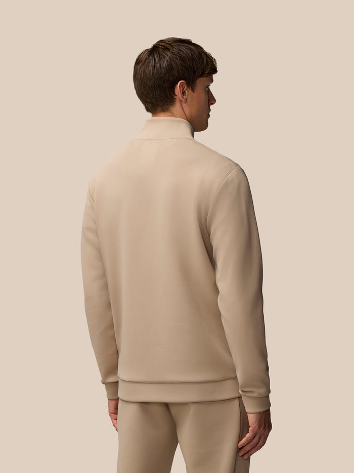 Back view of beige Flex Lifestyle 1/4 Zip top worn by a man