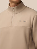 Beige jacket sleeve with Castore logo on the cuff.