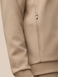 Beige mushroom gunmetal Flex Lifestyle quarter zip top with front zipper and zipped pockets.