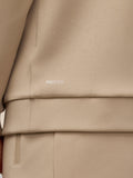 Close-up of beige ProTek fabric with water droplets and the ProTek branding