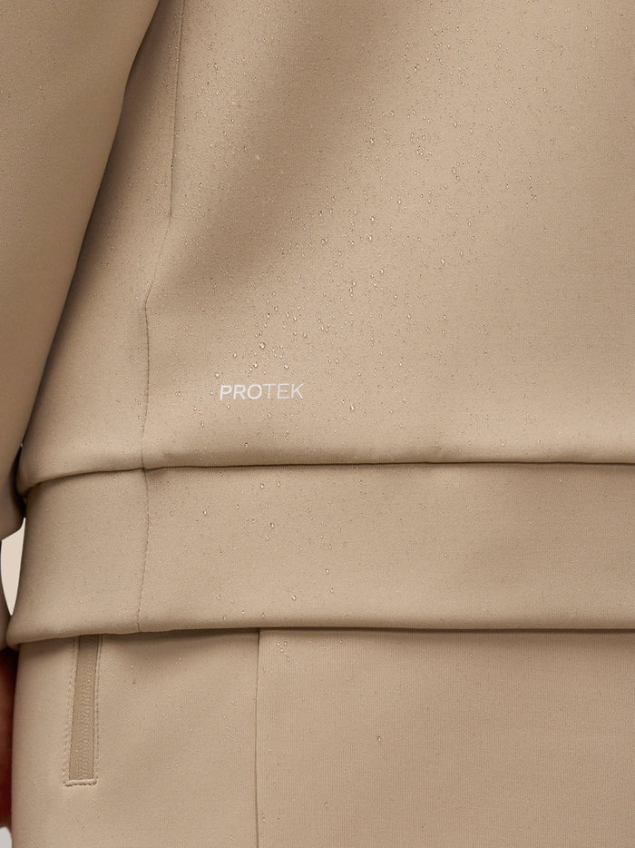 Close-up of beige ProTek fabric with water droplets and the ProTek branding