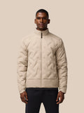 Man wearing beige padded jacket with front zip and quilted panels