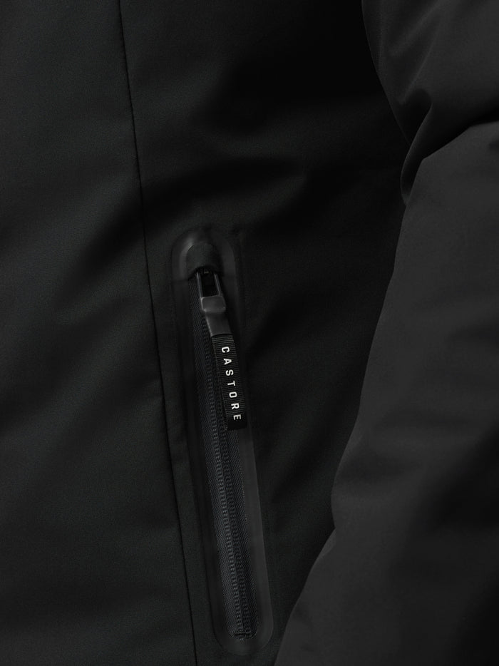 Close-up of a black jacket zipper pull with CASTORE branding on the zipper
