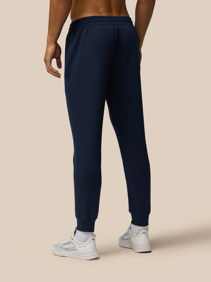Back view of navy Travel Lifestyle Joggers showing an elastic waistband and tapered legs.