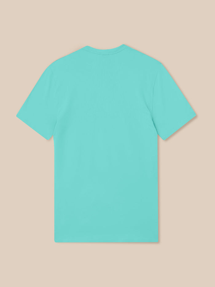 Back view of Zone Training T-Shirt in Light Aqua laid flat showing dropped hem and side slits.