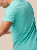 Side view of a model in light aqua Zone Training T-Shirt highlighting the relaxed fit.
