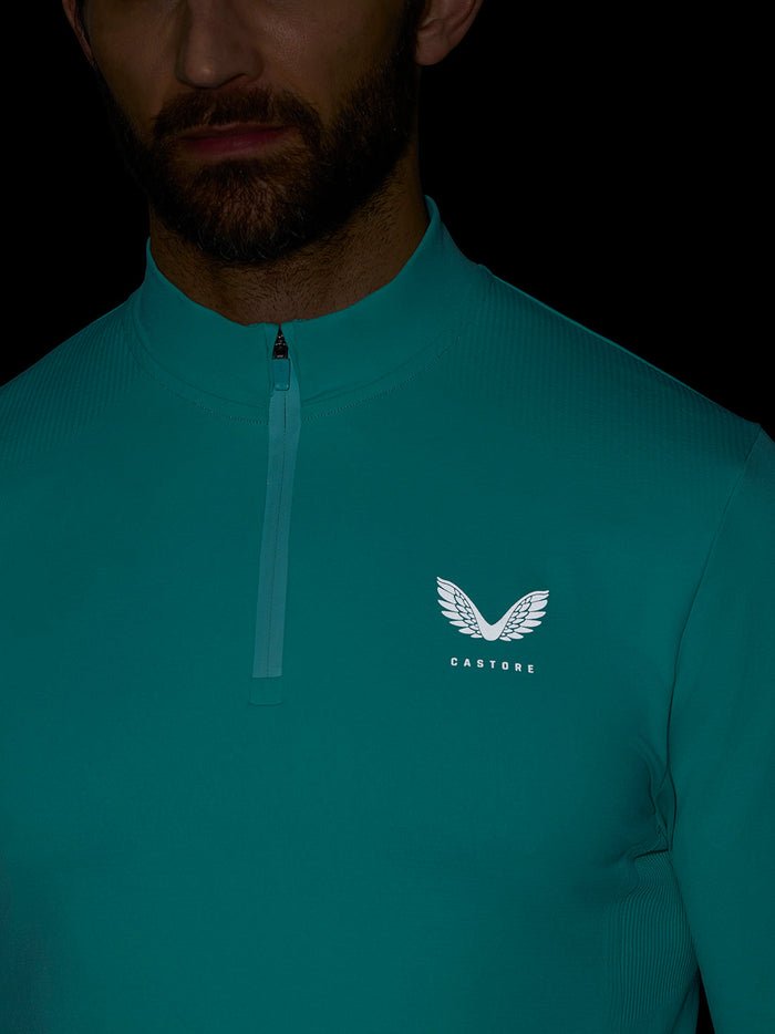 Teal quarter-zip athletic top with collar zip and Castore logo on left chest