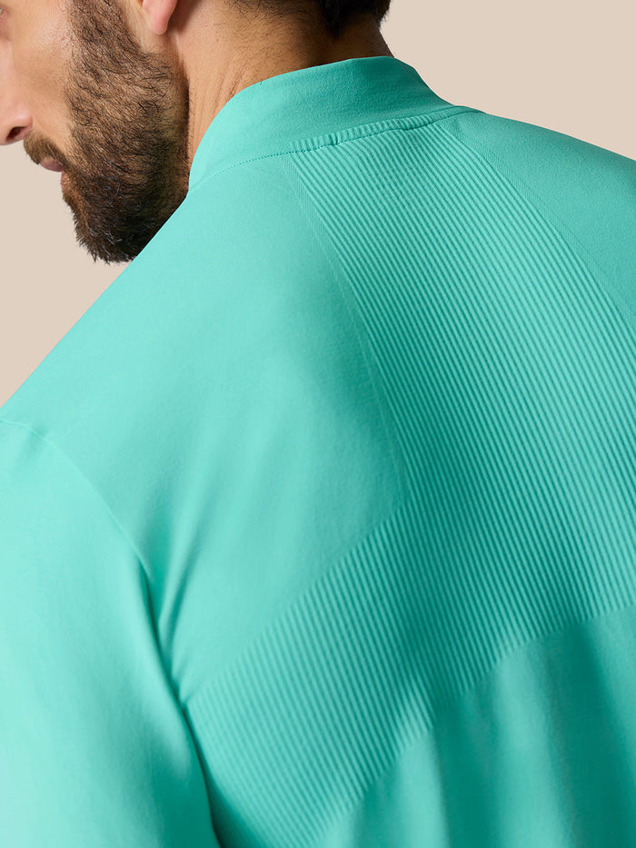 Close-up of turquoise Zone Training top showing ribbed back panel and smooth fabric