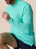 Close-up side view of light aqua Zone Training quarter-zip top on model with chest logo and zip detail