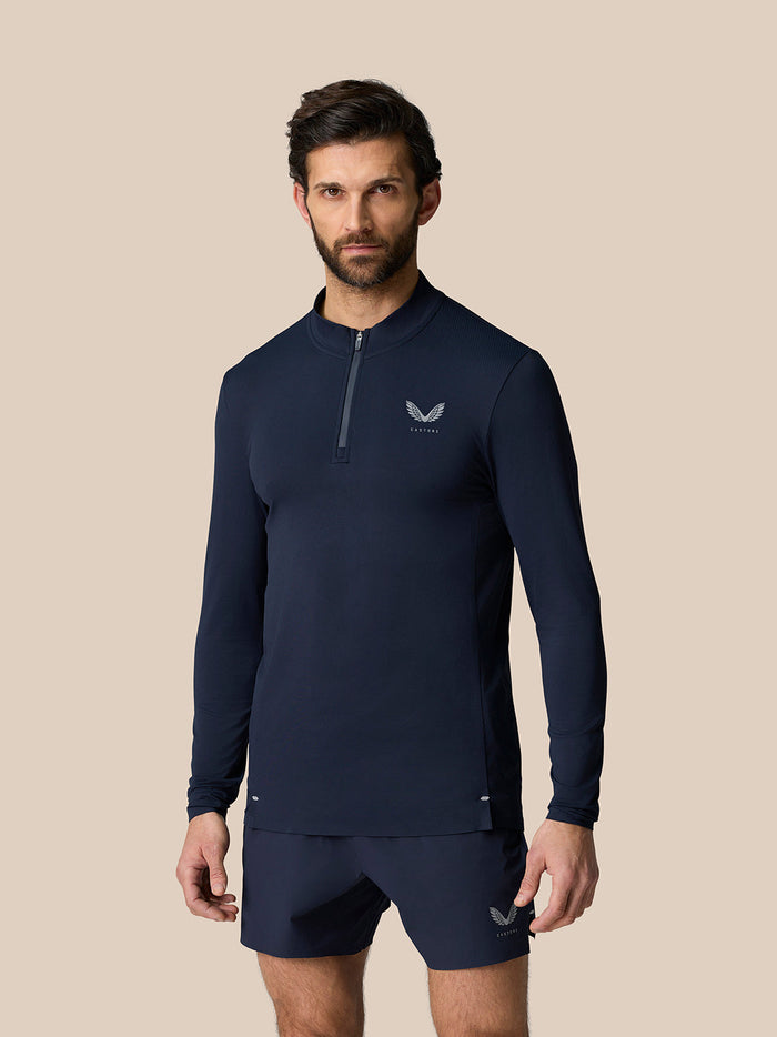Man in midnight navy Zone Training 1/4 Zip Top with high collar long sleeves and visible branding.