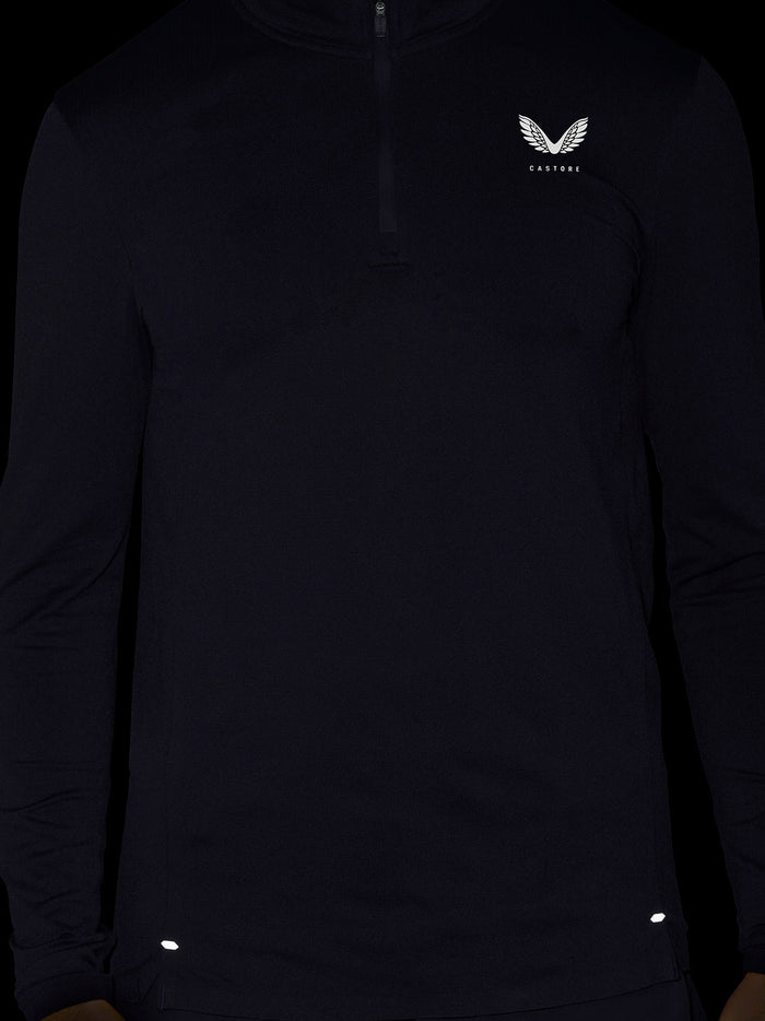 Front view of dark Zone Training 1/4 zip top with small left chest logo on knit fabric