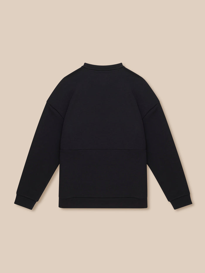 Back view of black travel lifestyle sweatshirt showing clean back and relaxed fit