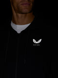 Close up of the white Castore wing logo on the chest of the black hoodie.