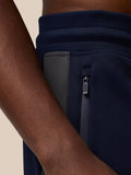 Navy Flex Thermo Pant side pocket with grey zipper and Castore zipper pull