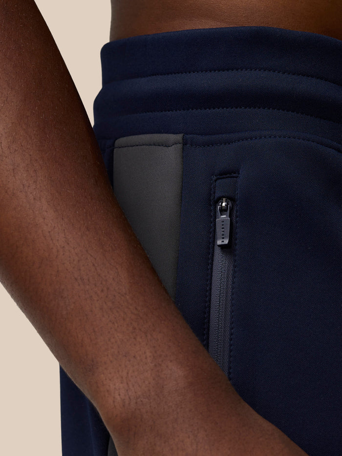 Navy Flex Thermo Pant side pocket with grey zipper and Castore zipper pull