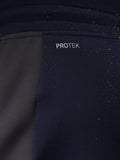 Close-up of navy Flex Thermo Pant fabric with ProTek branding and water droplets
