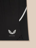 Close-up of black shorts with a white diagonal stripe and Castore wing logo near the hem.