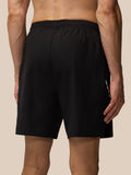 Back view of a man wearing Apex Training 6 inch Shorts in black