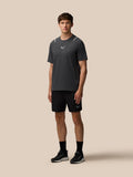 Front view of a man in Apex Training shorts with a logo on the left leg