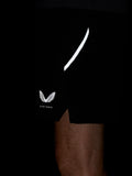 Close-up of black shorts showing a white curved stripe and the Castore wing logo.