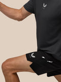 Close up of black Apex shorts showing Castore logo at the hem