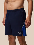 Side view of navy Apex Training 6 inch shorts with elastic waistband and Castore logo on left leg