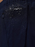Close up of navy Apex shorts fabric showing ProTek water resistance with droplets on the material