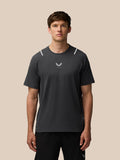 Rear view of a man wearing a gunmetal Apex Training T-shirt with reflective shoulder accents.