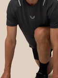 Model wearing black Apex Training T Shirt with reflective shoulder details and Castore logo on chest.