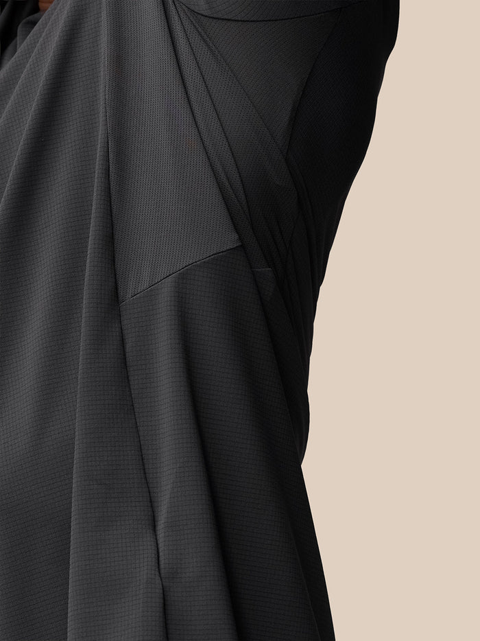 Close-up of dark textured fabric from the Apex Training T Shirt highlighting mesh panels.