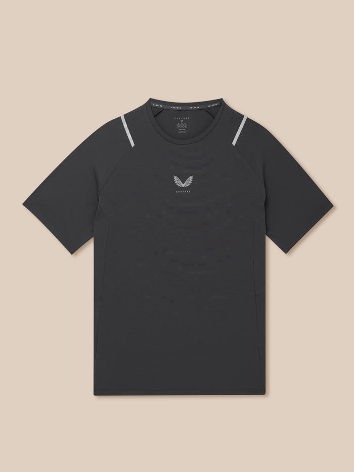 Close-up of dark Apex T Shirt fabric with Castore logo at center chest