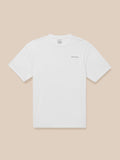 White short sleeve T shirt with small black CASTORE logo on the chest against a beige background