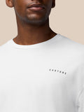 Close-up of a white crew neck T-shirt with a CASTORE logo on the chest.