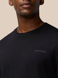 Close-up of black Flex Cotton T-Shirt on a model showing a round neckline and a small Castore logo on the chest
