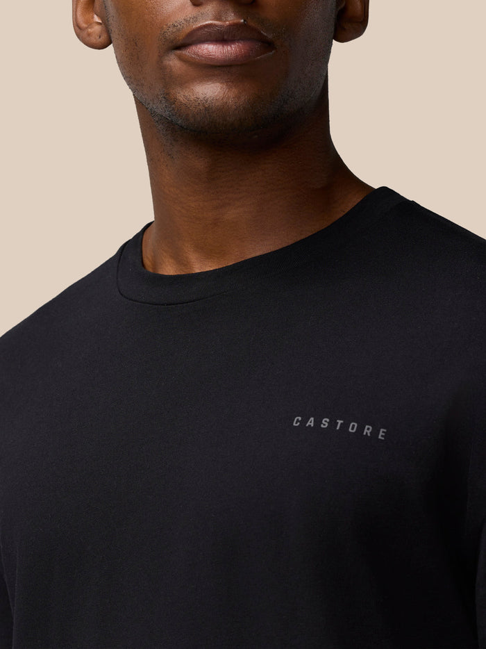 Close-up of black Flex Cotton T-Shirt on a model showing a round neckline and a small Castore logo on the chest