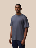 Male model wearing pewter Flex Cotton T Shirt with round neckline, short sleeves and a small left chest logo