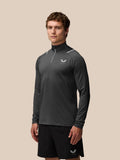 Male model wearing charcoal Apex Training Winterised 1/4 Zip Top with high collar and reflective detailing on shoulders