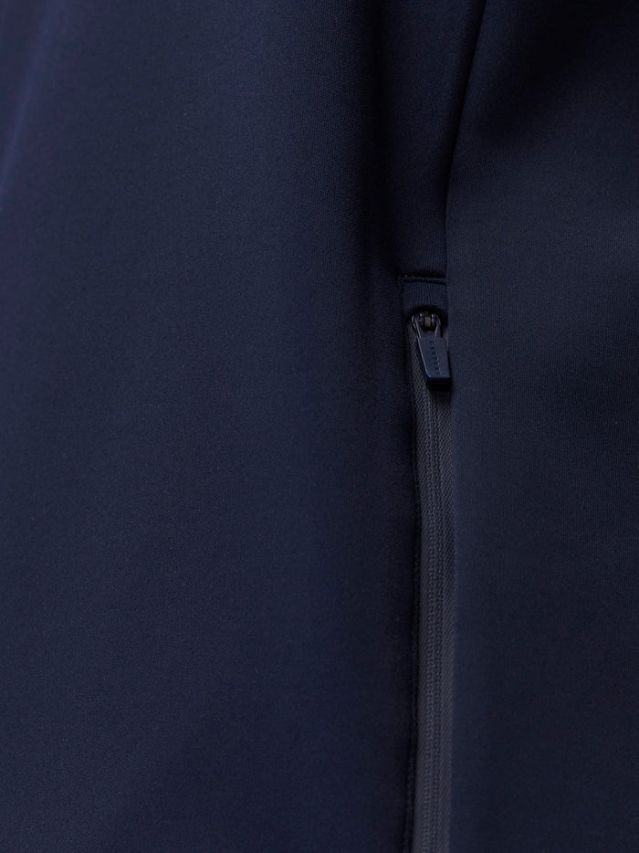 Close-up of navy hoodie fabric with a vertical zipper detail