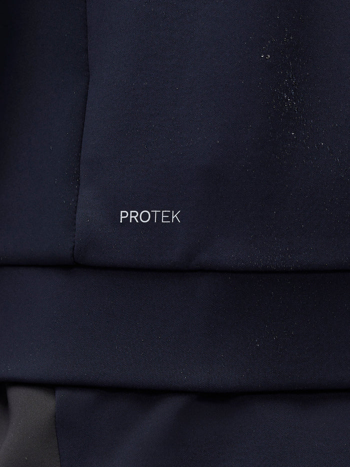 Close up of navy hoodie sleeve with ProTek lettering near the cuff