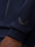 Close up of navy hoodie sleeve showing Castore logo on the cuff area