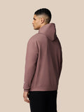 Side view of mauve Adapt Lifestyle Hoodie on a man with the hood up