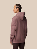 Back view of mauve Adapt Lifestyle Hoodie on a man with cornrows and hood up