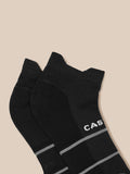 Close-up of black training socks in a 3-pack with white Castore branding on the cuff and grey stripes