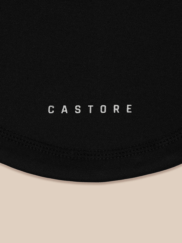 Close-up of black snood fabric with Castore branding visible on the lower section