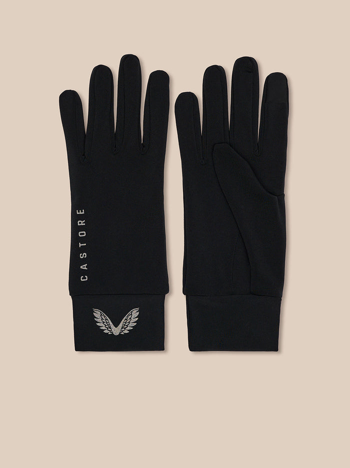Pair of black Castore Core Gloves laid flat with CASTORE branding along the wrist and a silver wing emblem at the cuff